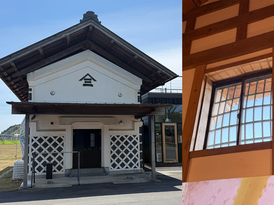 A white Japanese storehouse with a dark, overhanging roof and lattice panels, featuring a window with grid bars on the right.