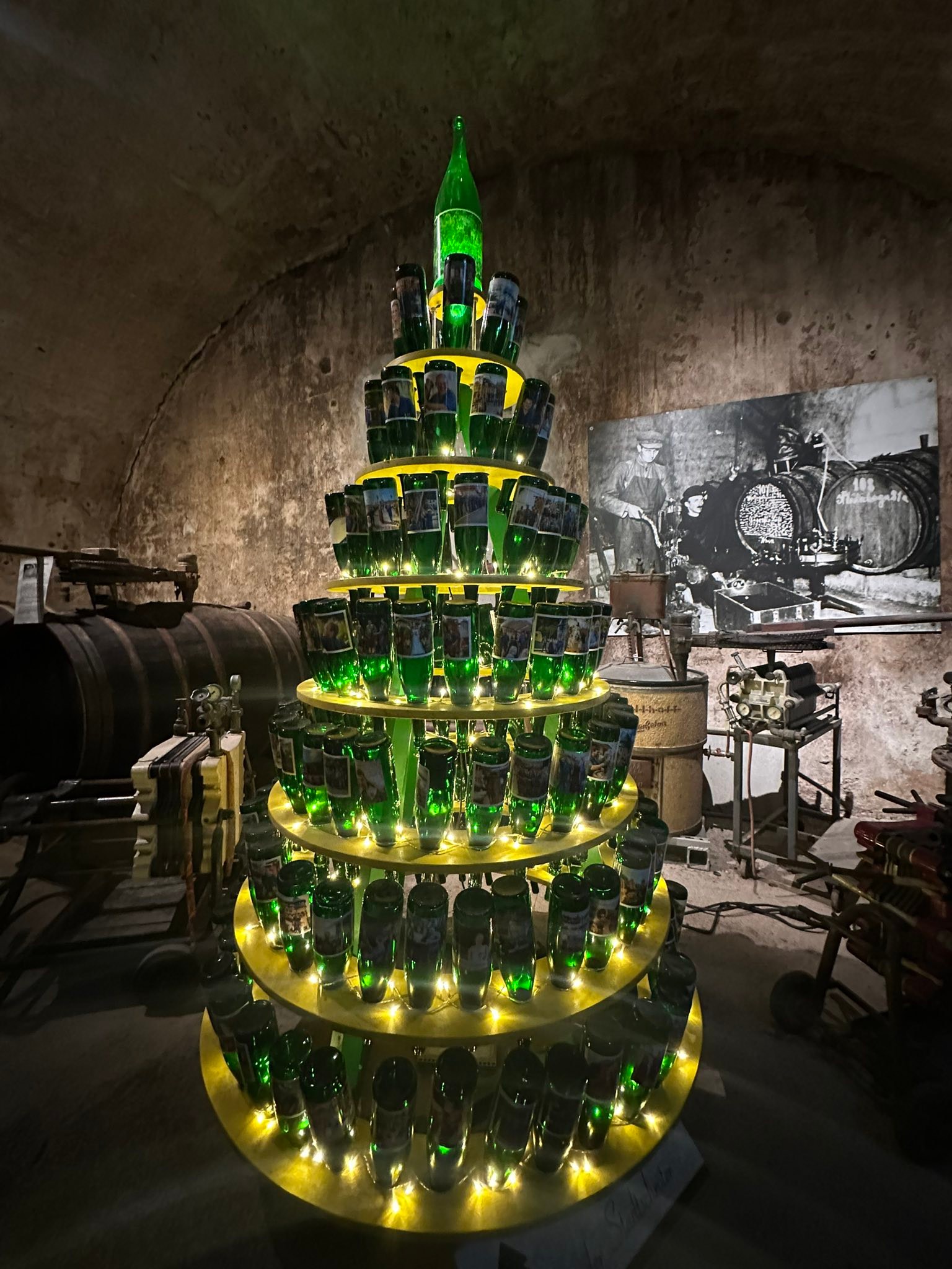 7. Traben-Trarbach Underground Wine Festival, Germany, features a festive pyramid of glowing green bottles.