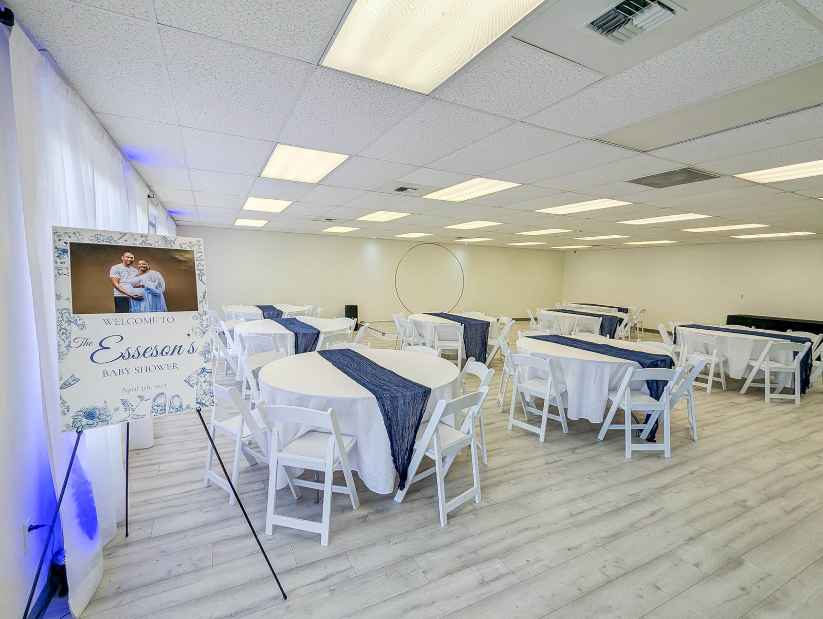 Event Archive, featuring numerous white tables draped with blue fabric runners.