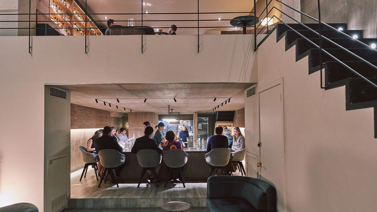 Atomix's intimate counter setting, with an open kitchen and a mezzanine lounge above.