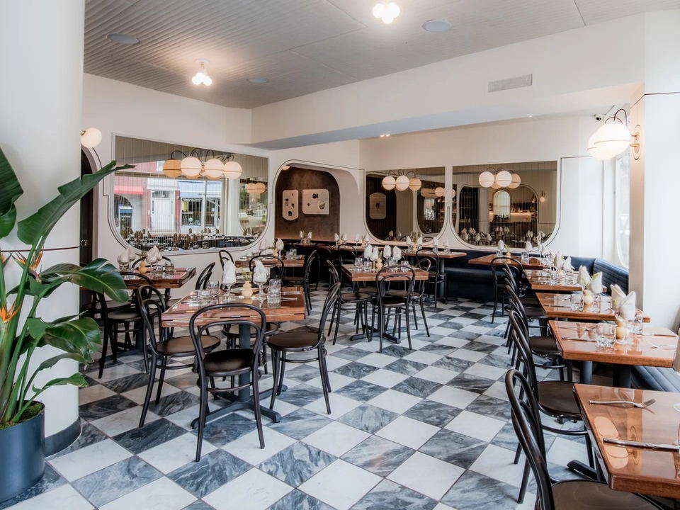 Elegant dining room with checkered floor and modern decor