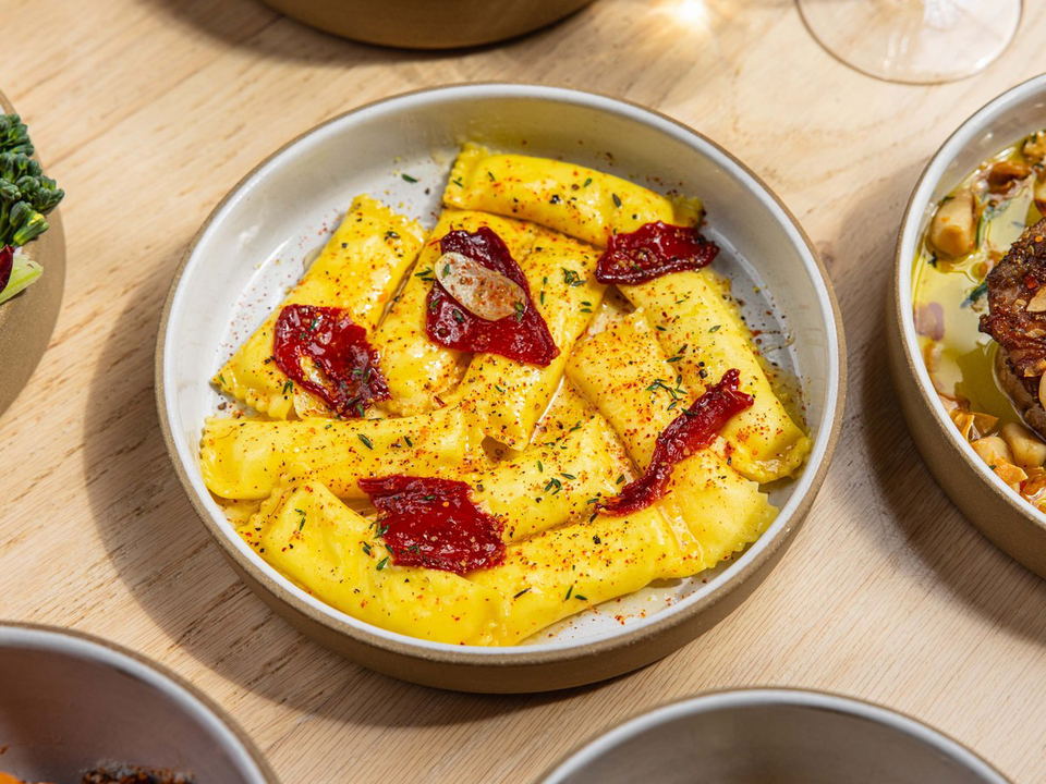 Ravioli with sun-dried tomatoes and herbs at a restaurant