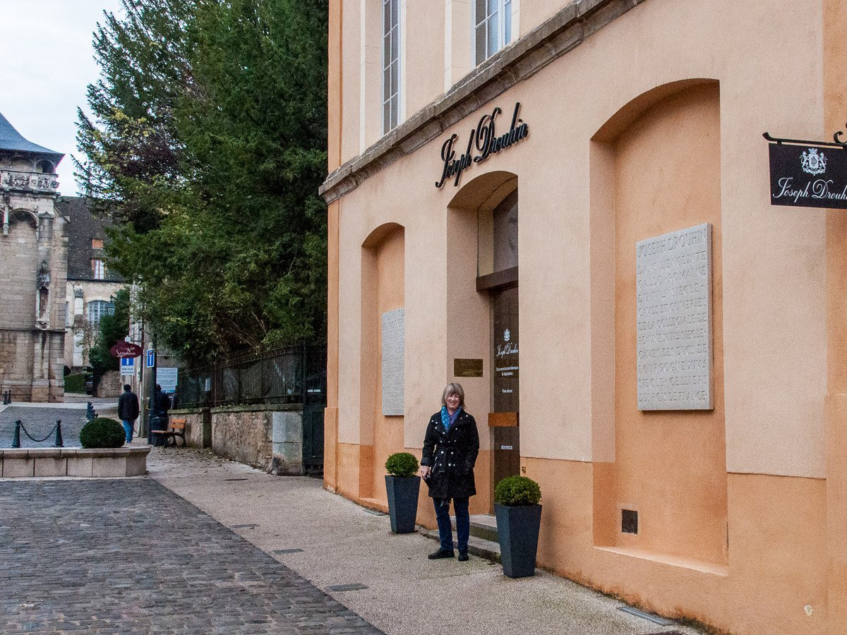 Entrance to Joseph Drouhin cellars in Beaune with a visitor.