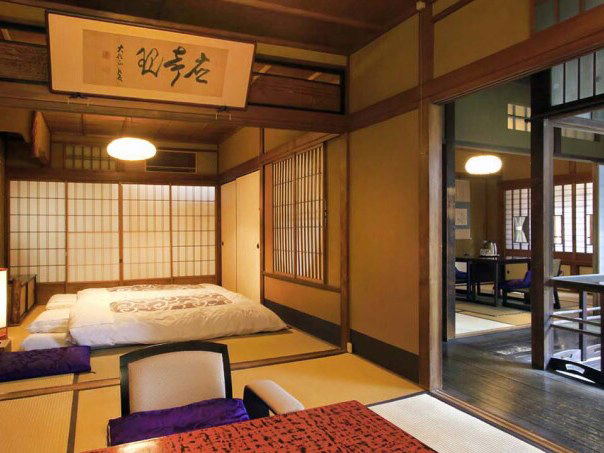 Traditional Japanese room with futon, tatami mats, and shoji screens.