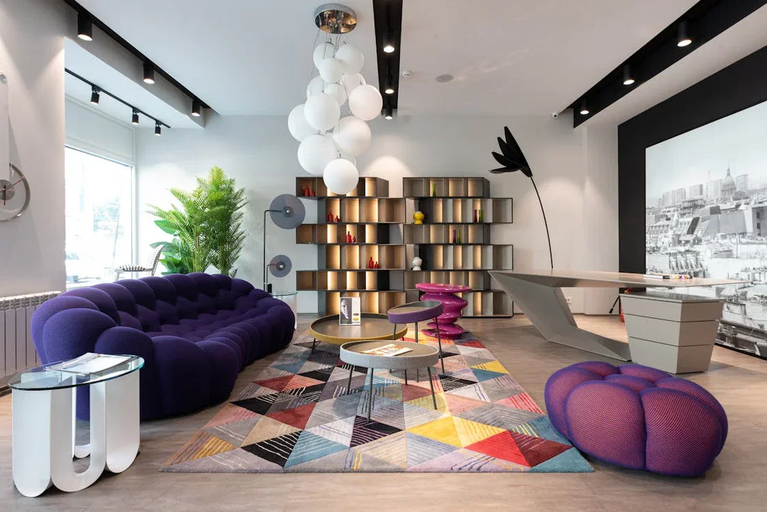 Comparative Analysis of Vintages features a distinctive, plush purple sofa.