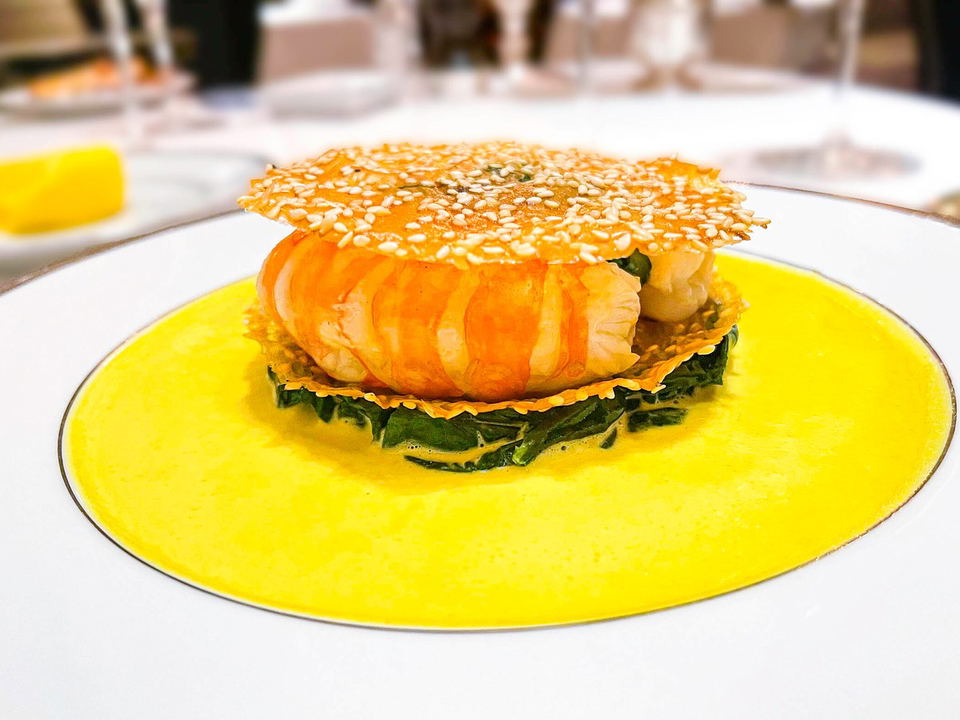 L'Ambroisie's signature feuillantine de langoustines, a masterpiece of classical French technique.