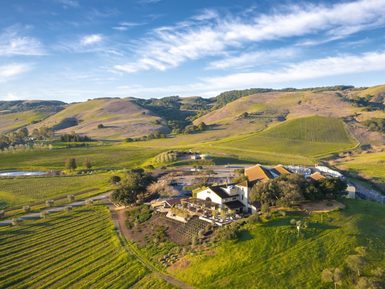 Aerial view of Schramsberg winery, vineyards, and surrounding hills.