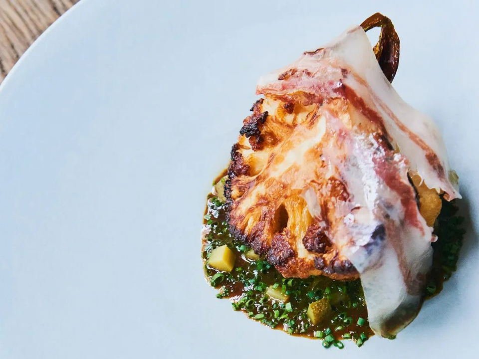 Septime's precise, ingredient-led dish exemplifies dining in Paris's 11th arrondissement.