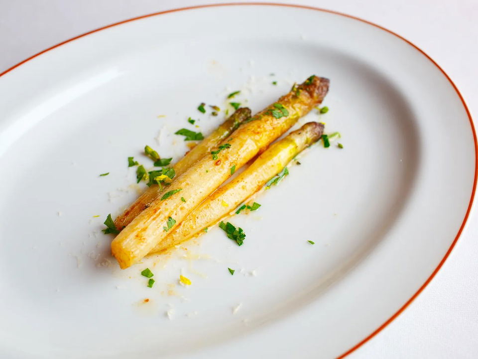 Arpège: Roasted white asparagus from a vegetable-forward tasting menu.