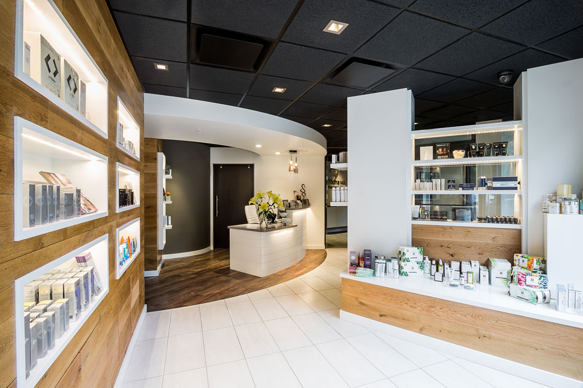Spa Services and Wellness Facilities feature warm wood paneling and bright white display shelves.