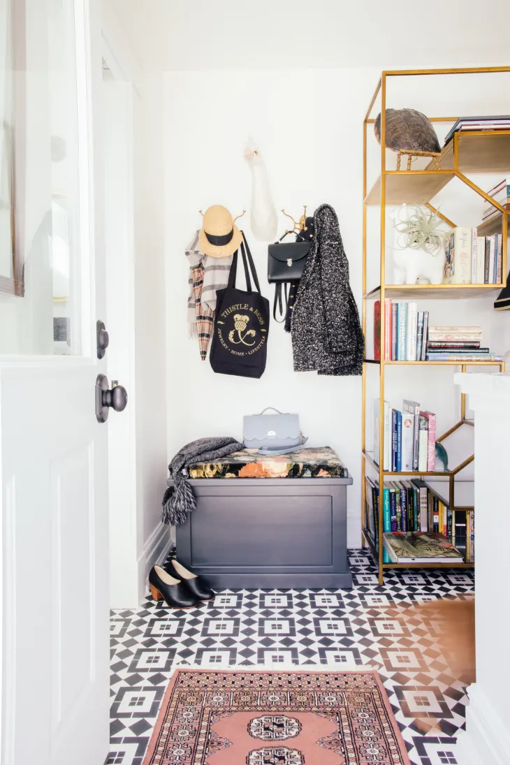 Practical Information for Guests, featuring a striking black and white patterned floor.