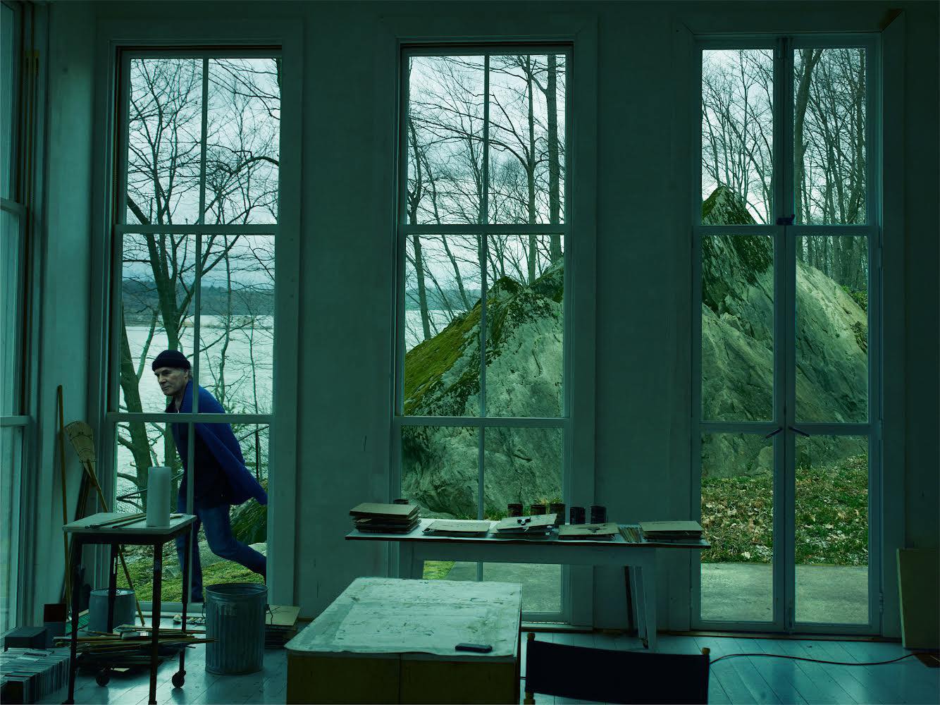 The Estate's Setting and History features a prominent moss-covered rock visible through large windows.