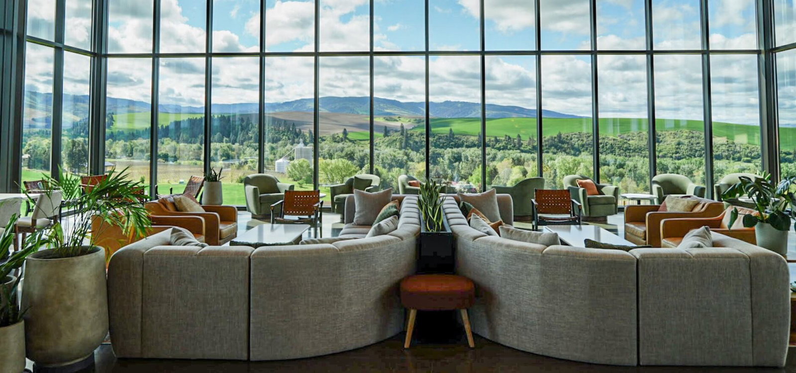 Conclusion: Force Majeure Tasting Experience features large windows framing the stunning green valley.