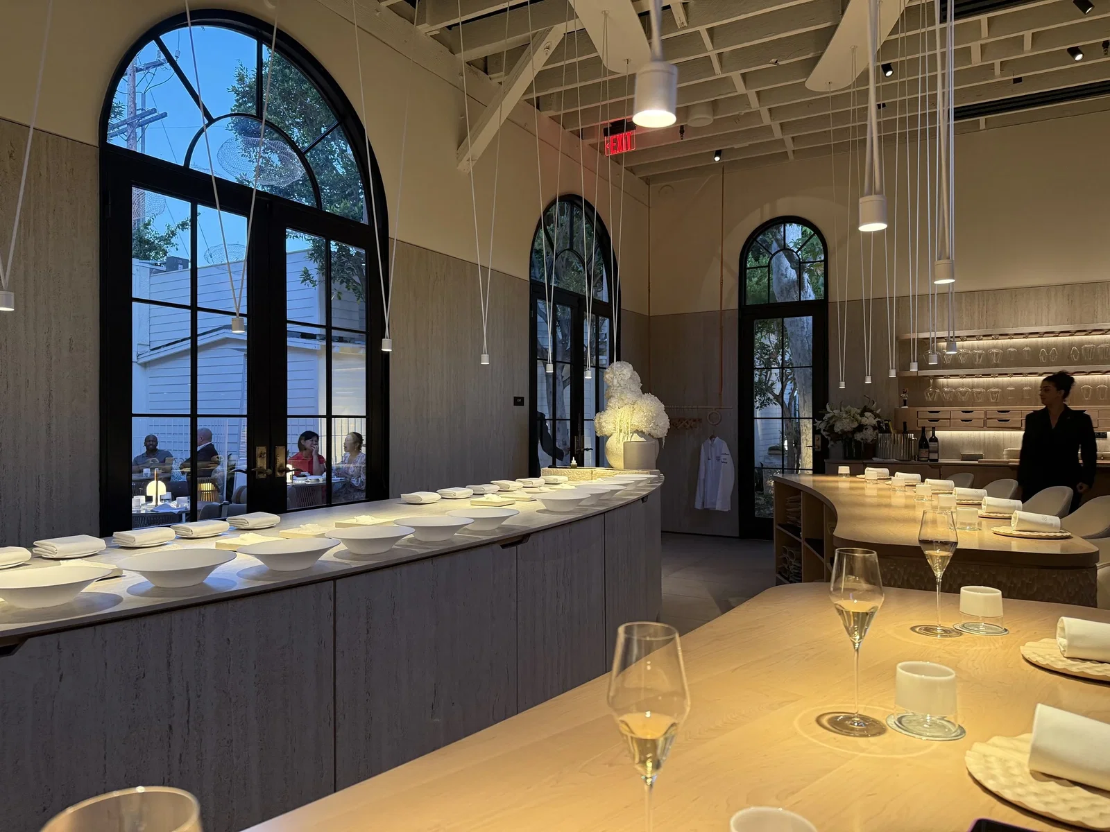Conclusion: A Premium Wine Tasting Experience features beautifully curved wooden tables.