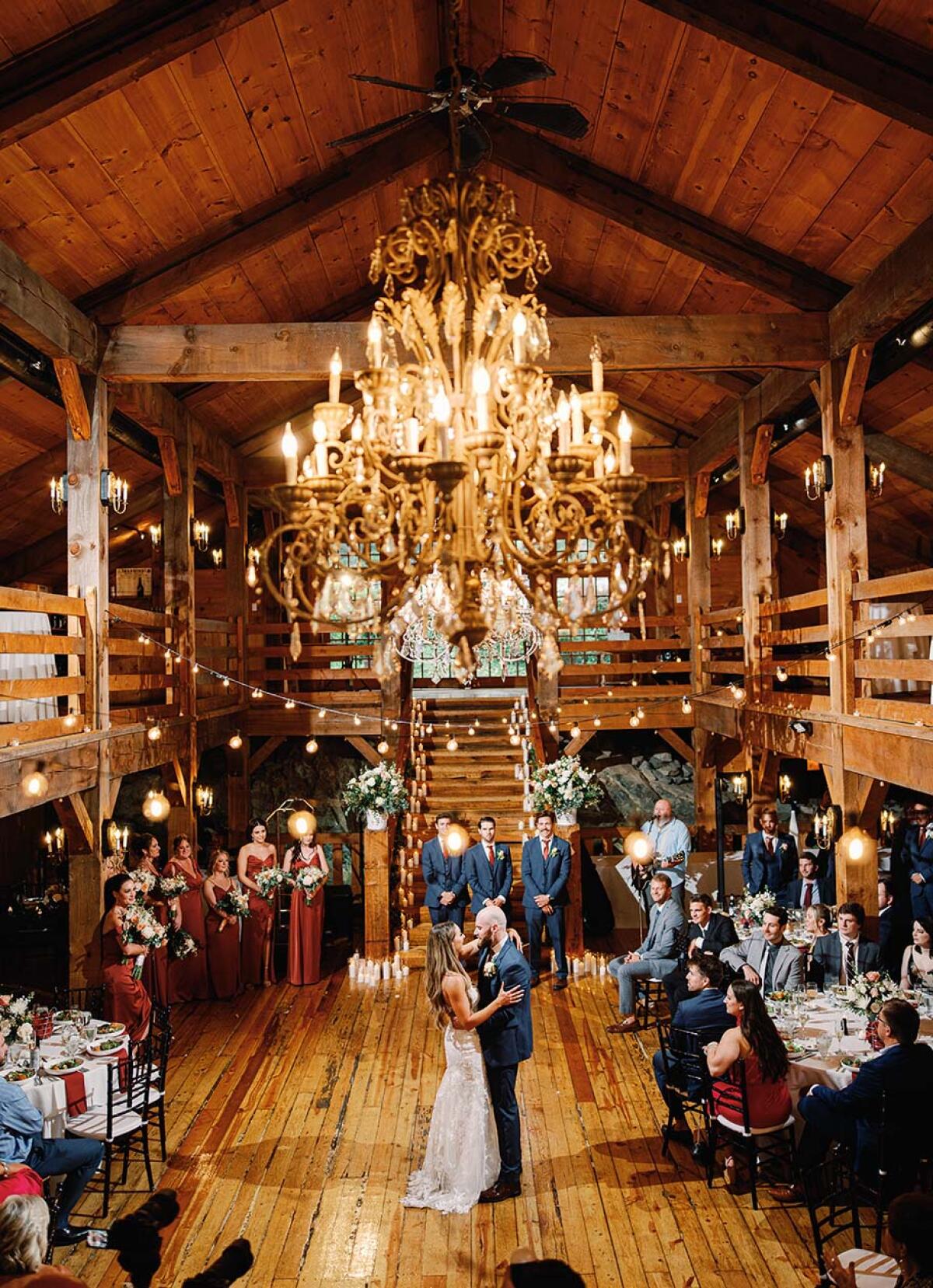 The Setting at The Barn features a grand, ornate chandelier as its centerpiece.