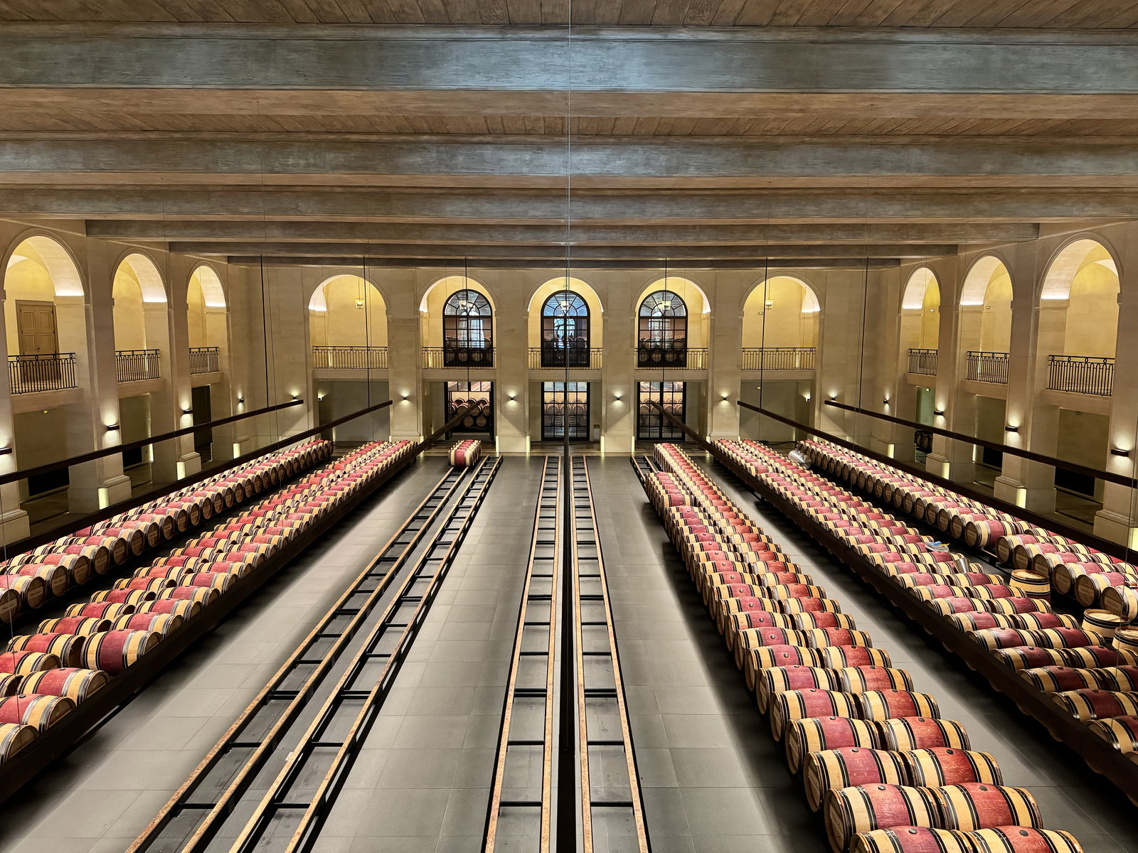 a long barrel room filled with red barrels