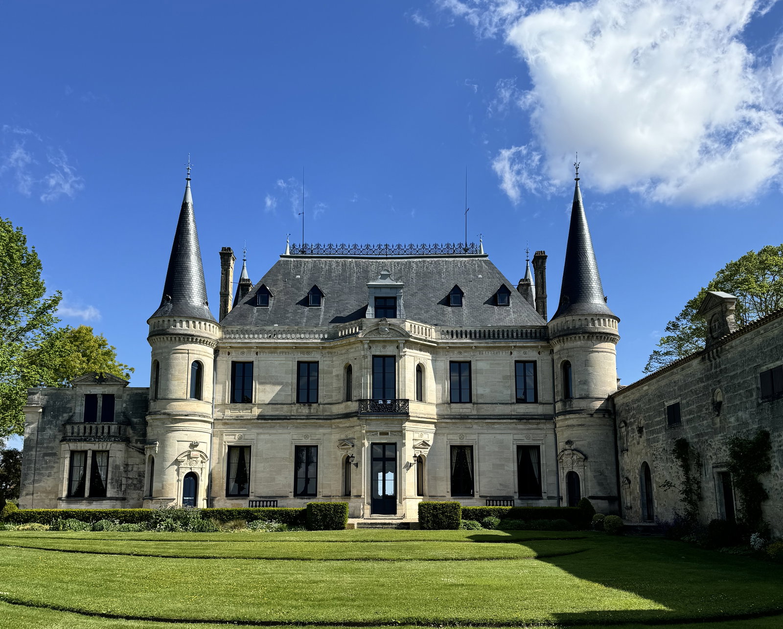 a large estate in front of a grass field