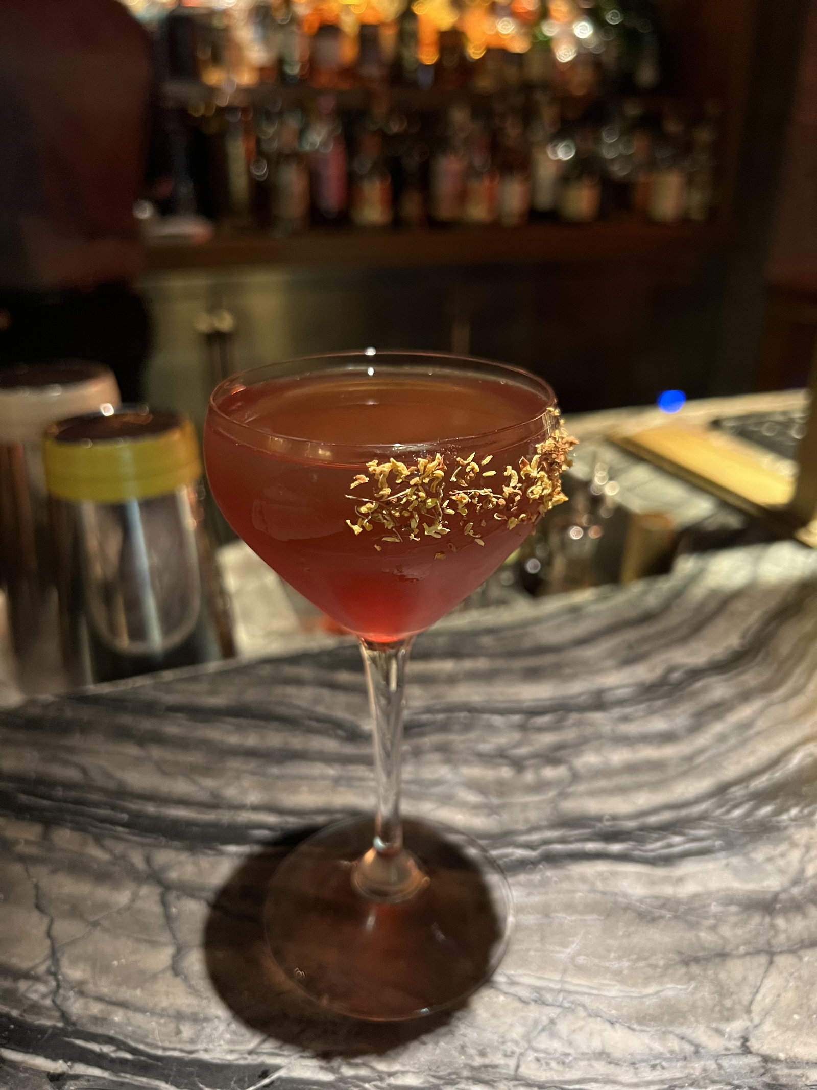 a cocktail served up at a bar