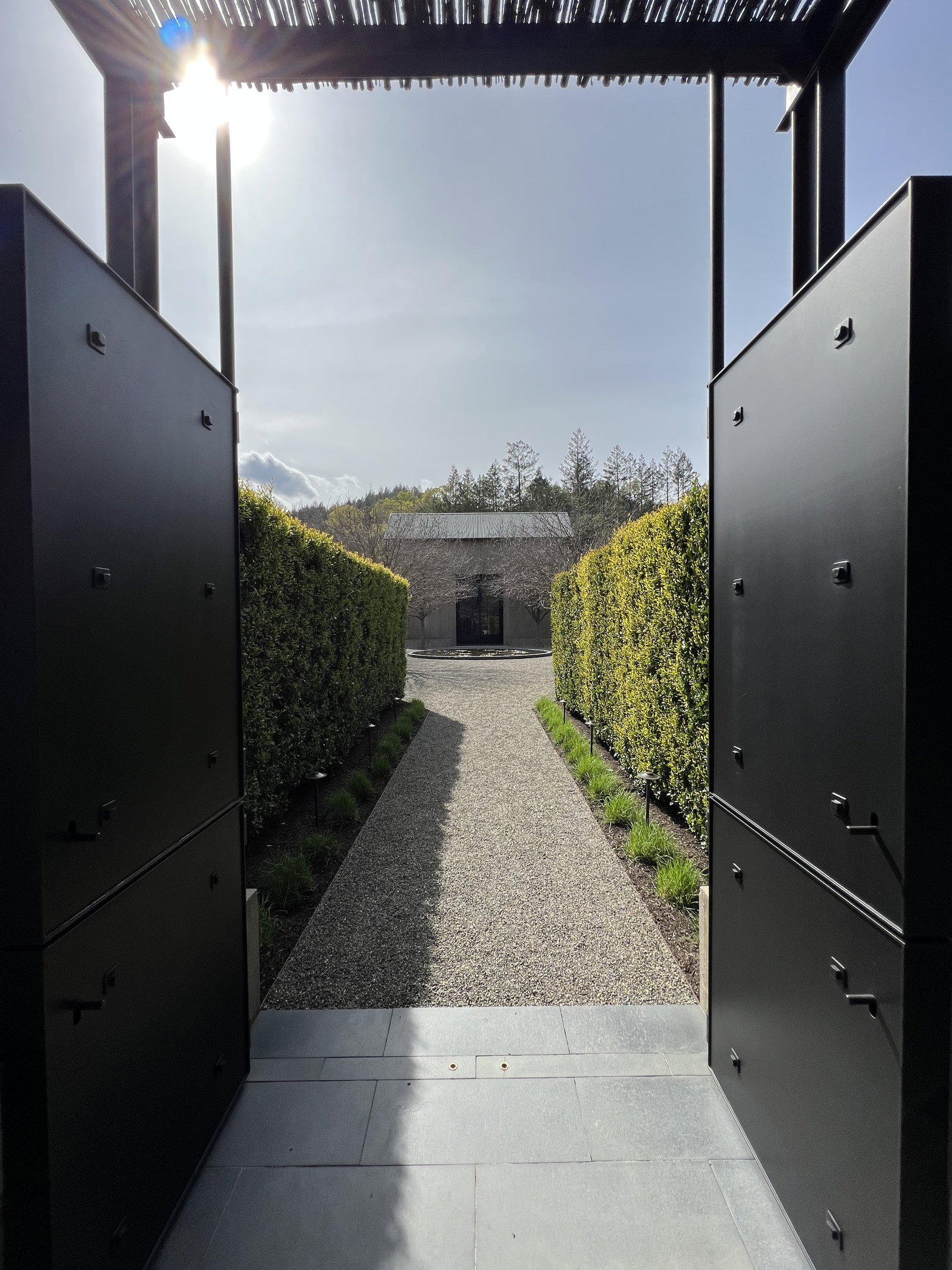 the entrance to a winery with big metal doors