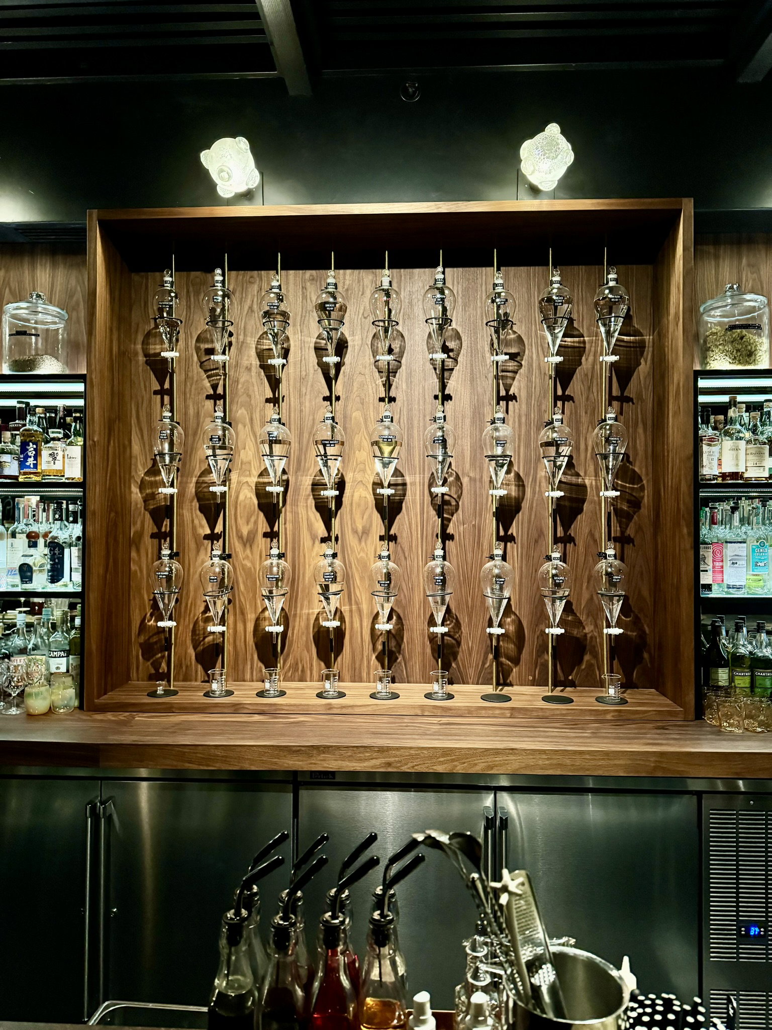 a wall of glass beakers