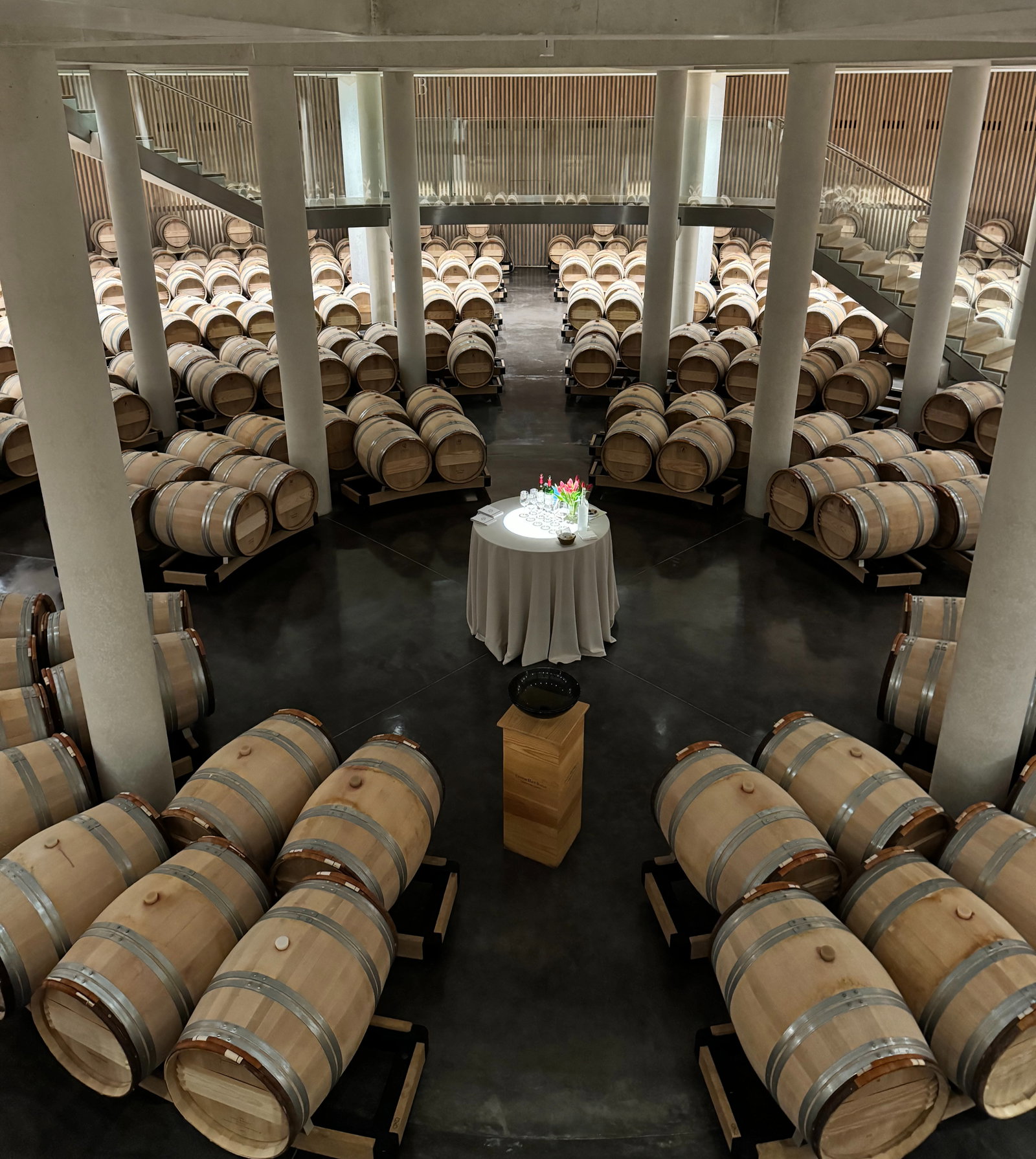 a circular wine cellar with a table in the middle
