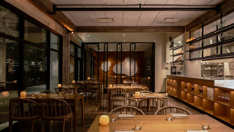 The dimly lit dining room at Michelin-starred Kato Restaurant