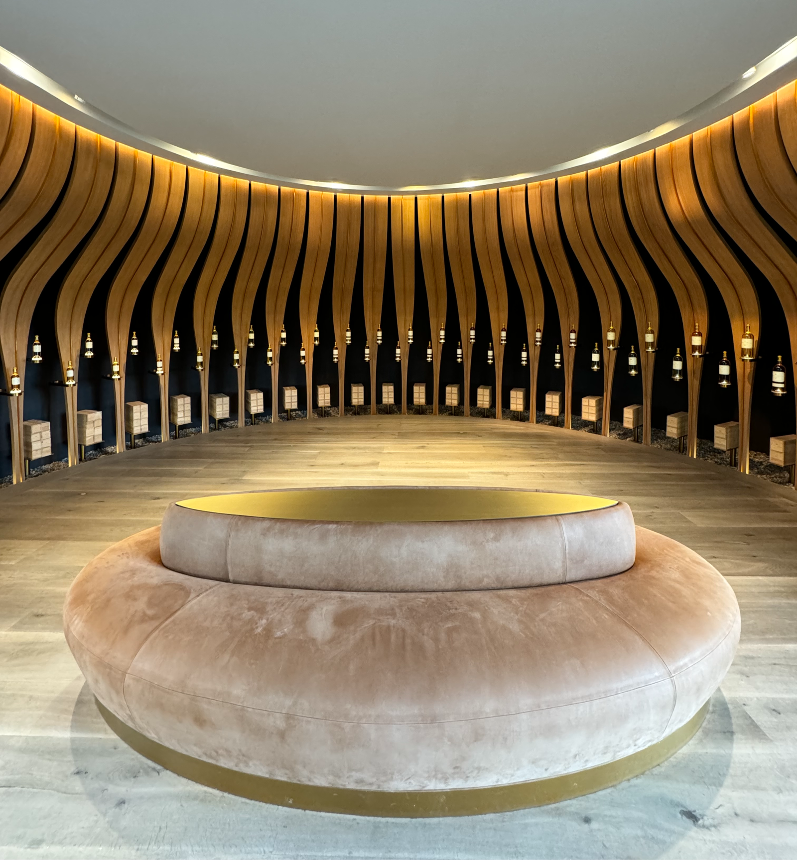a lobby of a winery showcasing wine bottles
