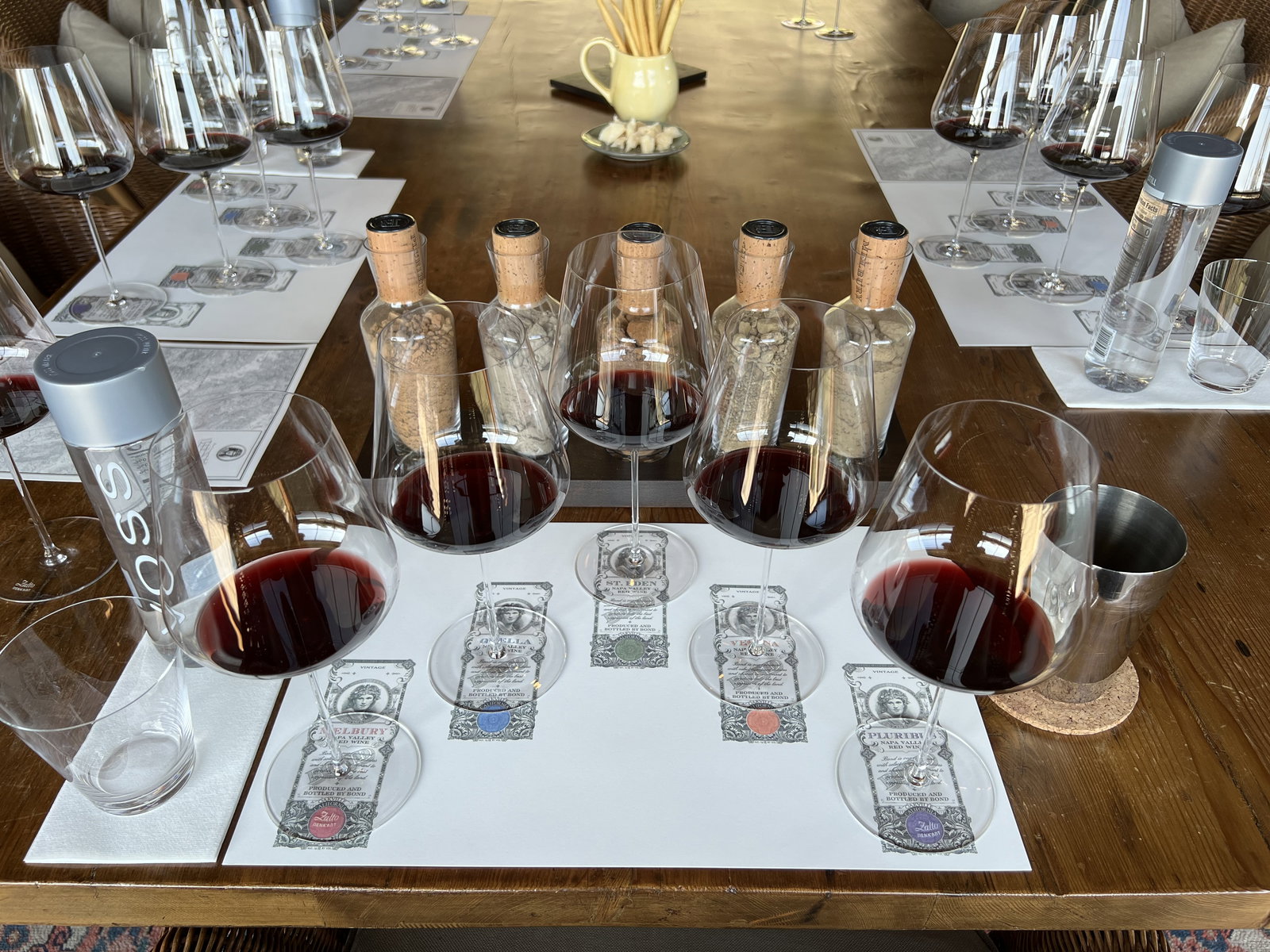 five glasses of wine on a table