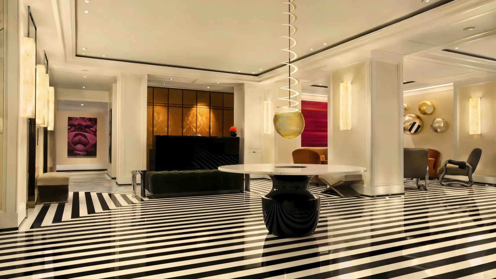 Modern lounge with black and white striped floor, sleek furniture, abstract wall art. Warm lighting creates a stylish, inviting atmosphere.