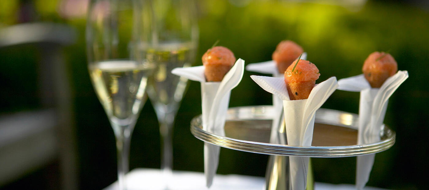 Salmon is packed into a funnel shaped pastry and held in a napkin