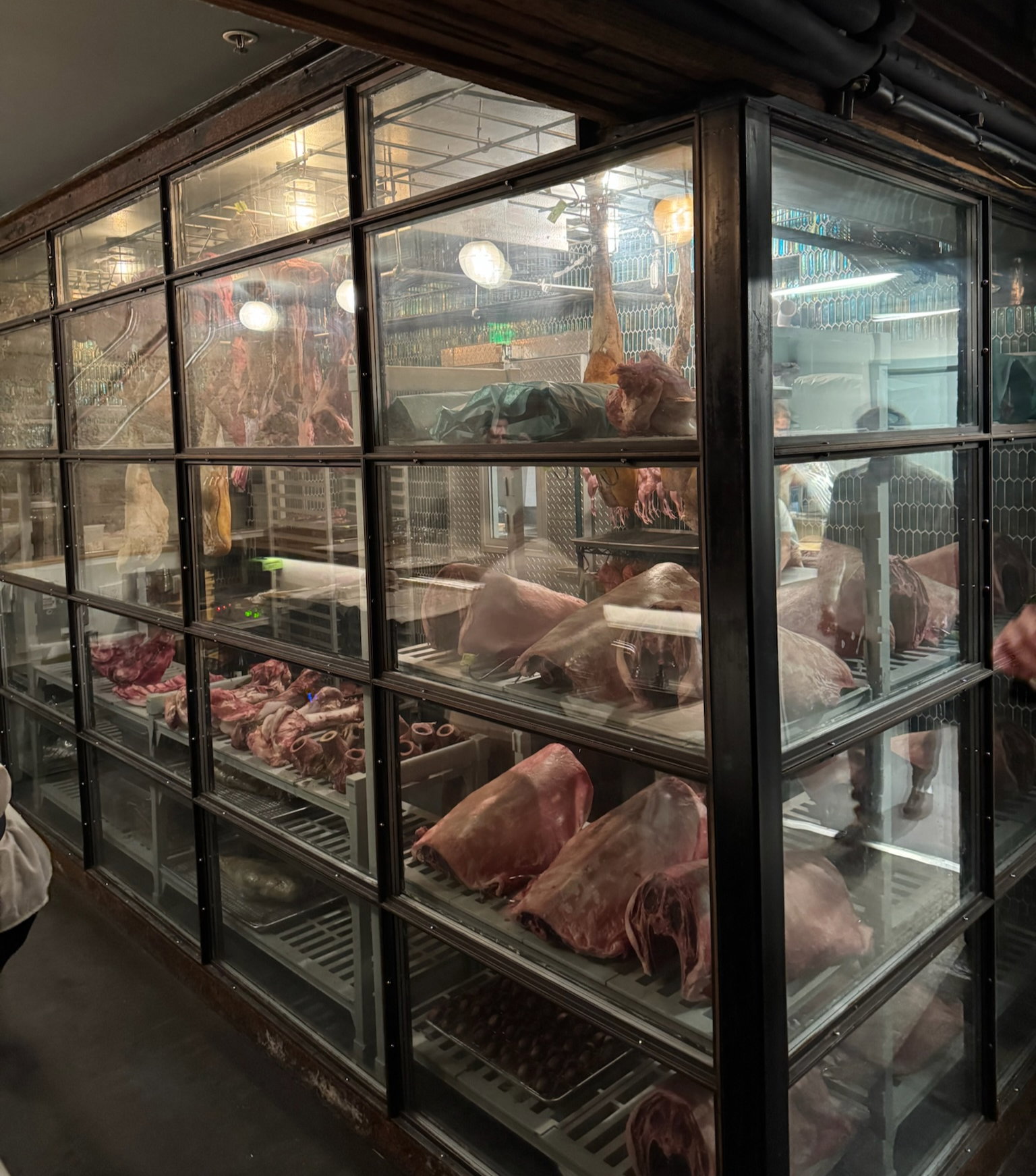 Various game meats hang in the curing room in the basement of Birdsong.