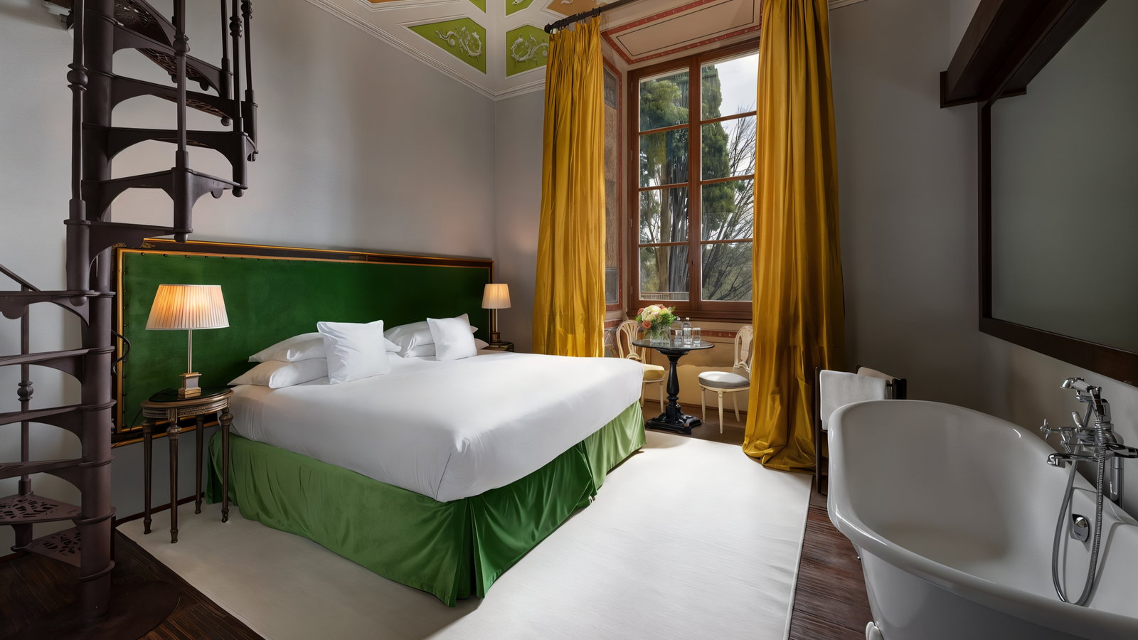 Luxurious bedroom with a cozy white bed, green accents, yellow curtains, spiral staircase, and a bathtub. Large window with a garden view.