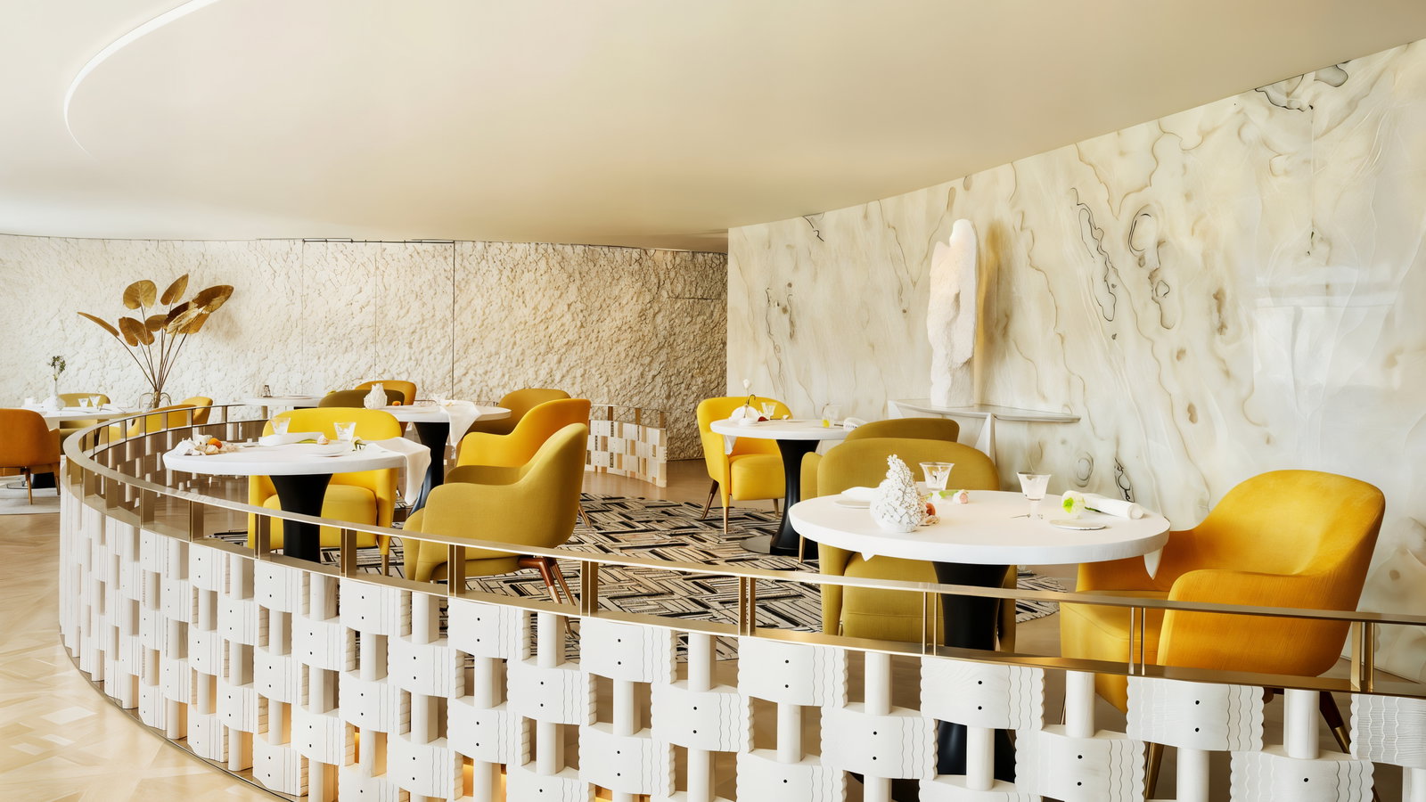 Elegant restaurant with yellow chairs, white tables, abstract wall art, and textured beige walls. Calm, modern ambiance with soft lighting.