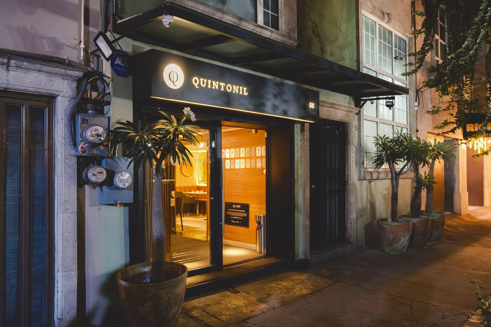 The exterior of Quintonil, dimly lit up at night