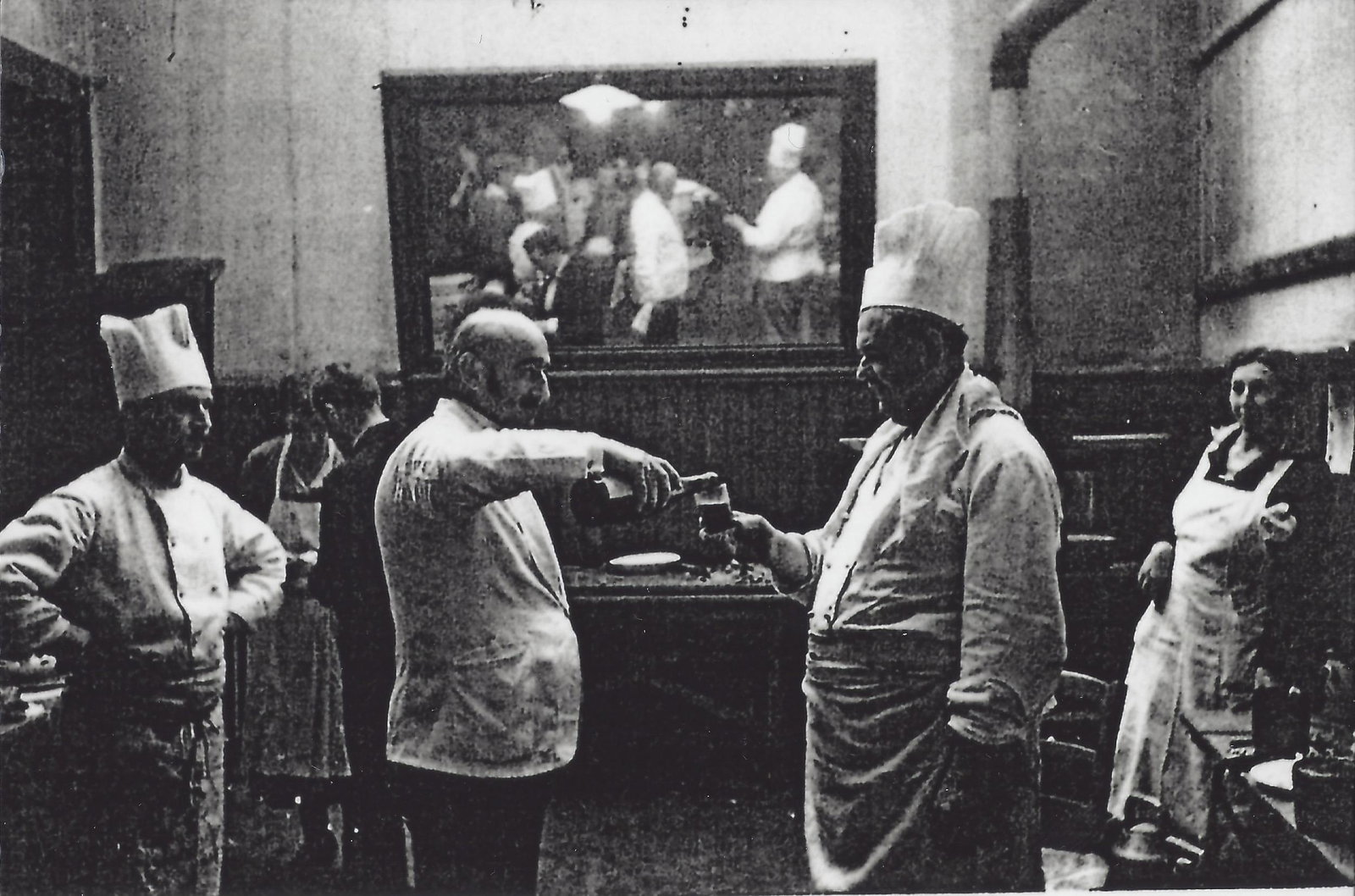 A winemaker pours a sample of his wine at La Paulée
