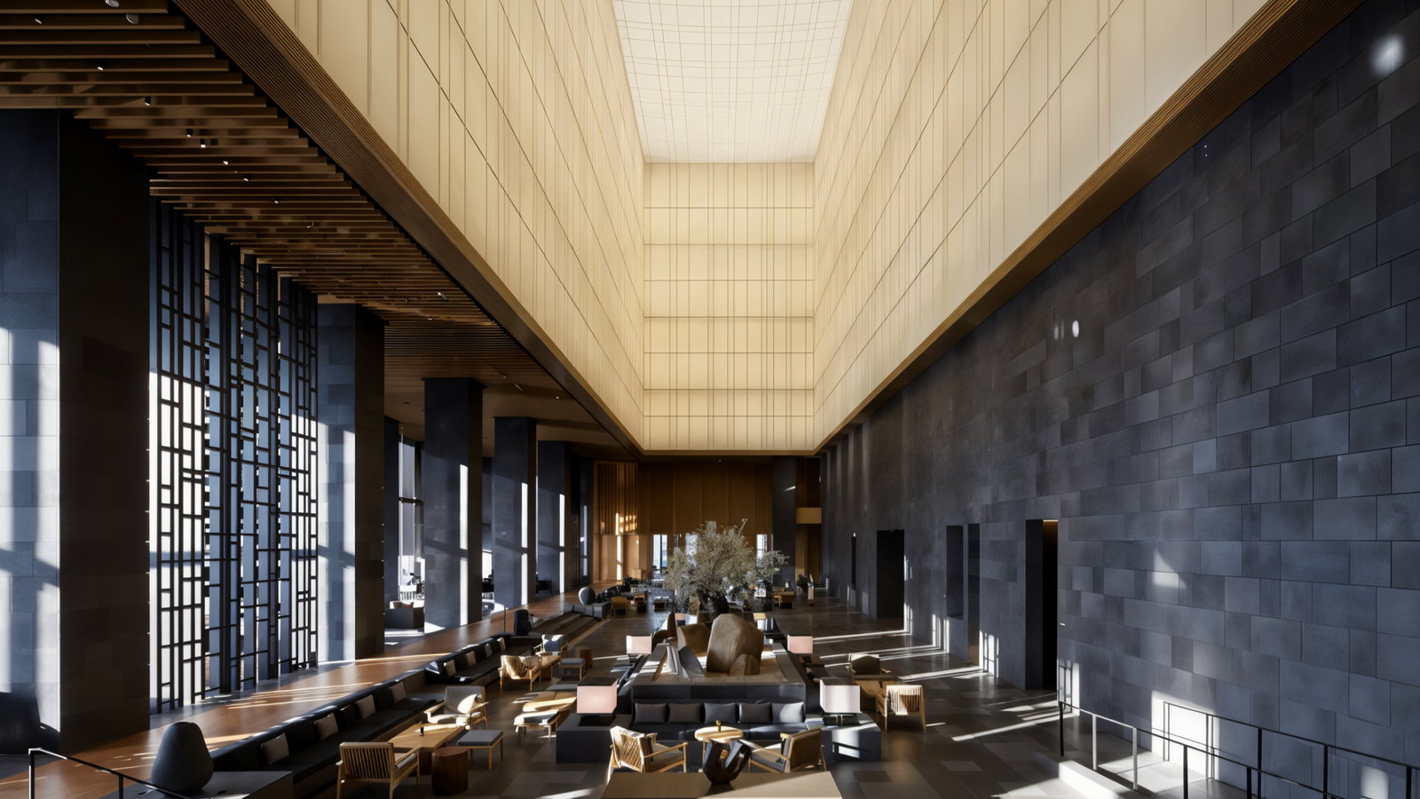 Spacious modern lobby with tall ceilings, geometric patterns, and neutral tones. Sunlight streams through windows, highlighting seating and decor.