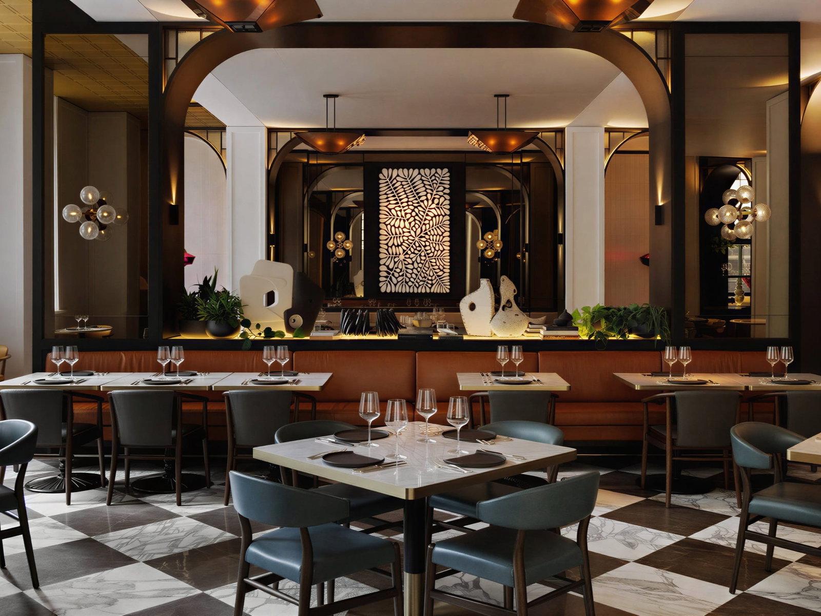 Brasserie 1930 dining room at Capella Sydney interior with checkered floor, brown and blue seating, abstract art, round lights, and set tables for four; modern ambiance.