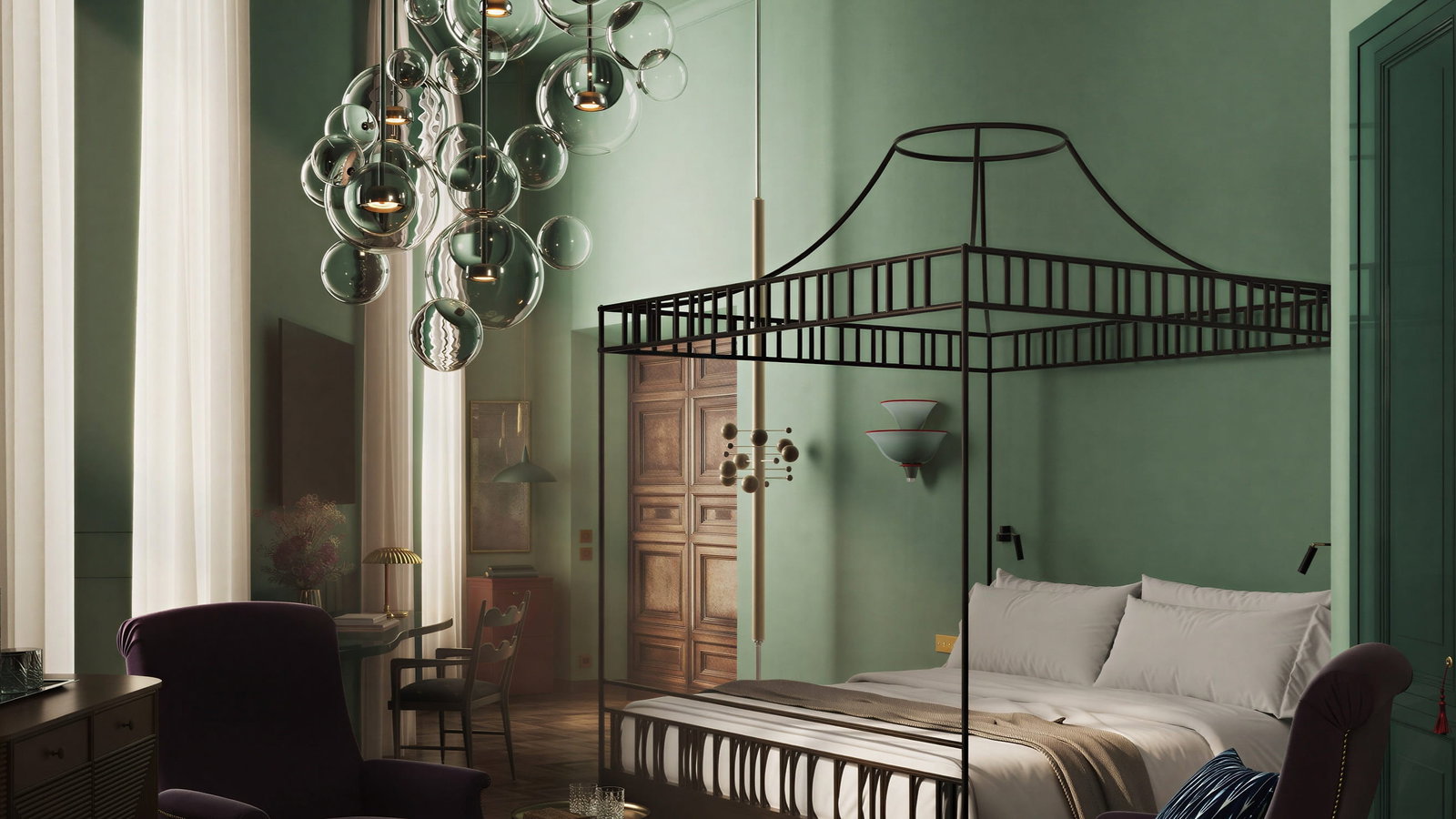 Elegant Junior Suite bedroom at Palazzo Talìa with green walls, canopy bed, bubble chandelier, and cozy seating. Warm lighting creates a serene ambiance.