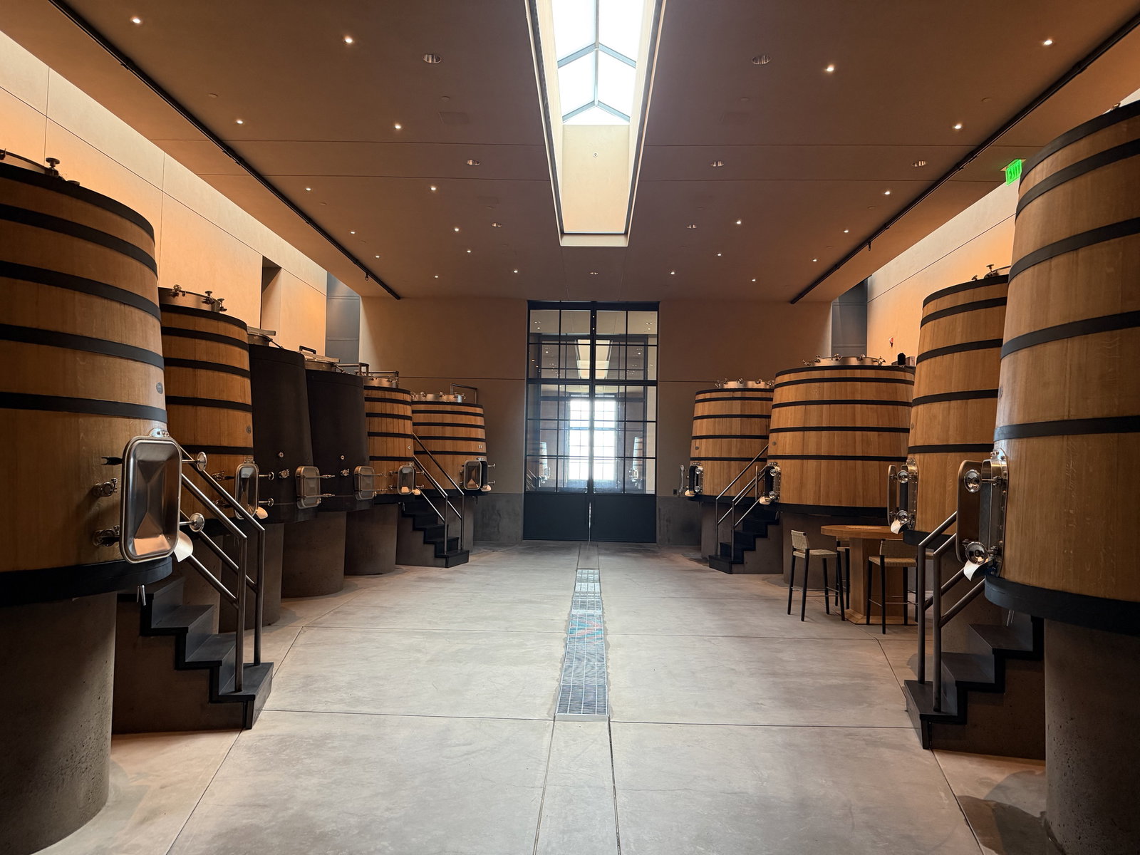 Fermentation room at Continuum Estate with large wood and concrete vessels
