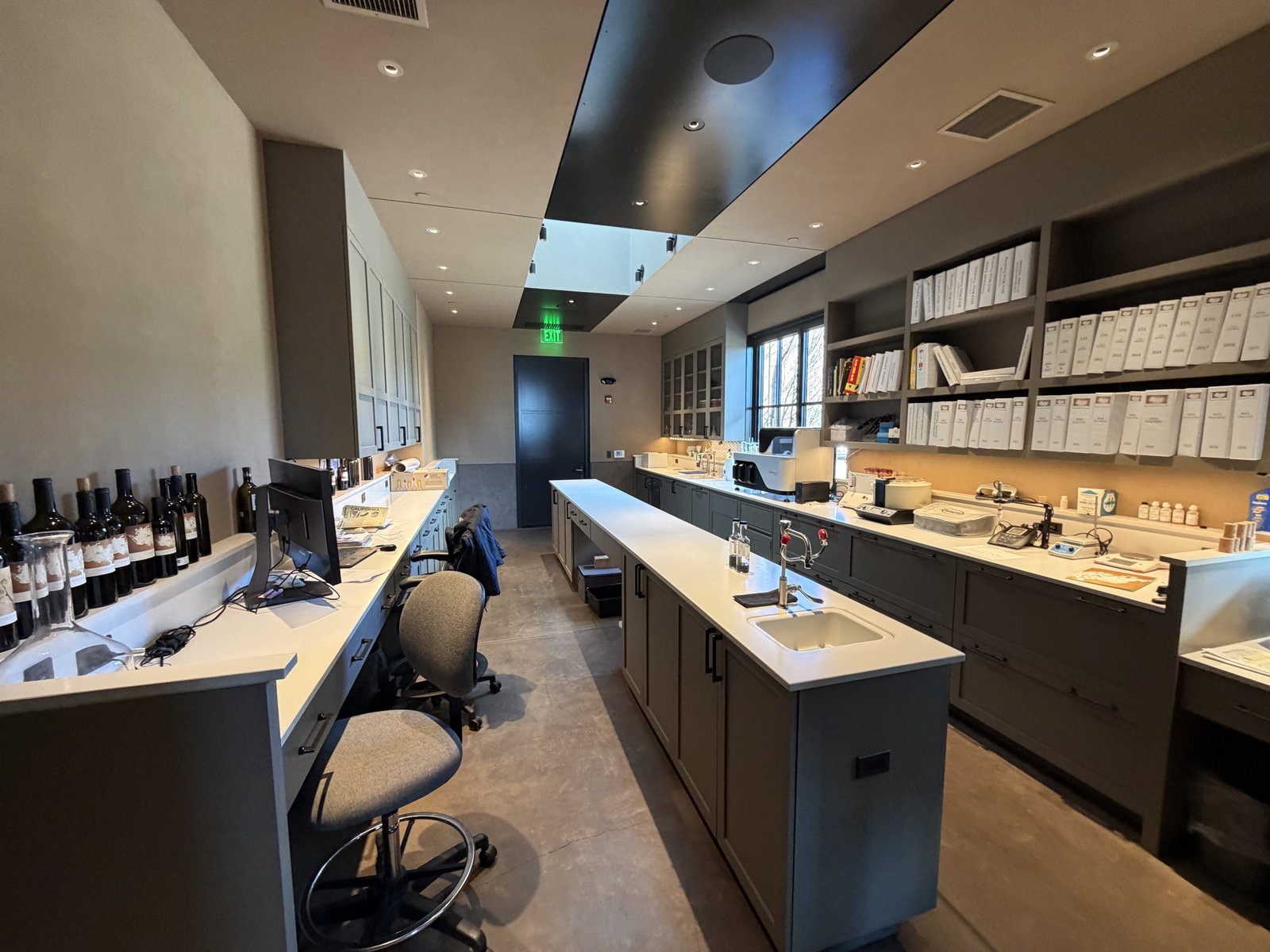 Working production and tasting space at Continuum Estate with bottles and lab equipment