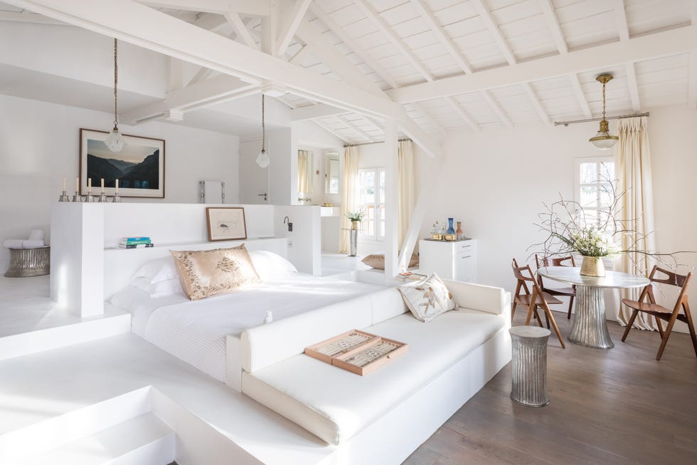 A bright, white guest room at Les Sources de Caudalie